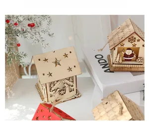 Close-up of Nordic wooden Christmas cabin with warm internal LED light and star cutouts