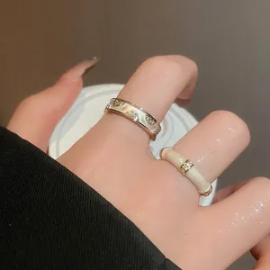 18k gold plated double layer cross open ring with cubic zirconia stones on model hand