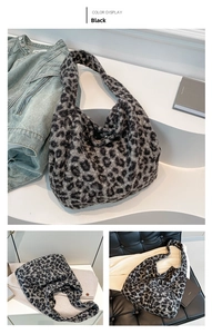 Detail of the black leopard print plush tote bag with a soft faux fur wide shoulder strap