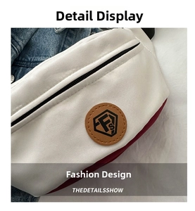 Detail shot of Oxford fabric chest bag showing FS logo patch and white-red stitching