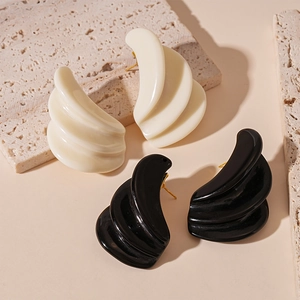 Irregular resin geometric earrings in cream and black with layered shell design