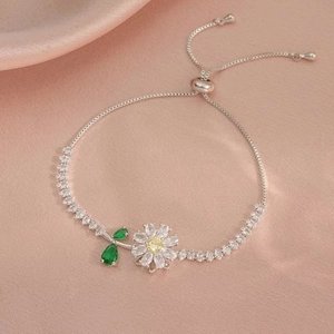 Detail of adjustable silver daisy bracelet with yellow, white and green zircon stones