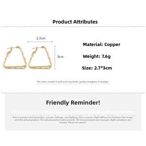 Detailed view of geometric golden triangle earrings with size and weight measurements