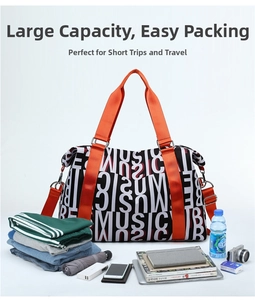 Large travel bag with music letter print showing clothes and accessories storage capacity