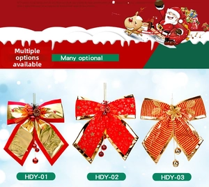 Detailed view of red and gold Christmas bows with glitter stars, cones and small bells