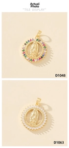 Detail of round Virgin Mary pendants in gold finish with colorful zircon stones inlay