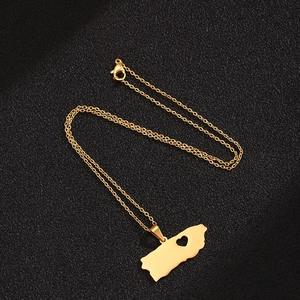 Polished gold Puerto Rico map pendant necklace with heart cutout on black fabric