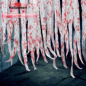 Detailed shot of tattered white Halloween gauze featuring realistic red blood splatters