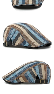 Detail view of cotton striped beret showing paisley patterns and adjustable metal buckle