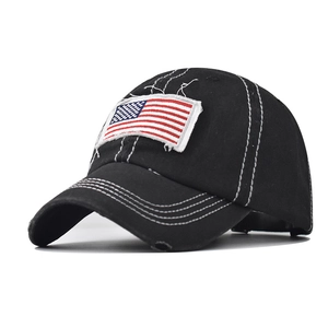 Close-up of distressed cotton fabric with flag patch and contrast stitching details
