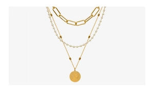 Detailed view of triple-layered gold titanium necklace with pearls and coin pendant