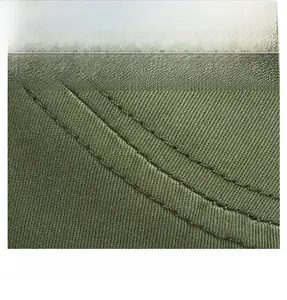 Detail of olive green canvas hat featuring reinforced double-stitched sewing and fabric texture