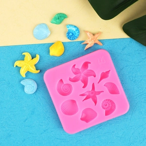 Pink silicone mold for starfish and seashell fondant or resin crafts with detailed textures