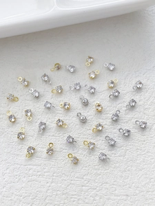 Macro shot of assorted gold and silver rhinestone pendants for DIY jewelry crafting