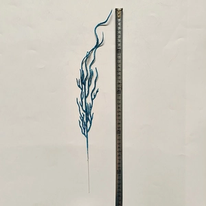 Detail of 45cm royal blue glitter branch decoration with measuring tape for size reference