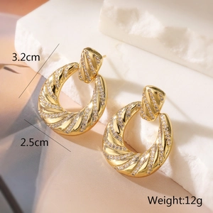 Detail showing dimensions 3.2cm by 2.5cm of gold-plated twisted earrings with zircons