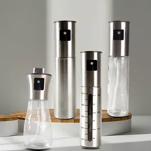 Set of glass and stainless steel oil sprayers for kitchen cooking with measurement scales