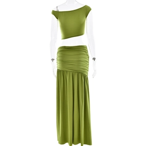 Detail view of the green one-shoulder cropped top and pleated maxi skirt with side slit