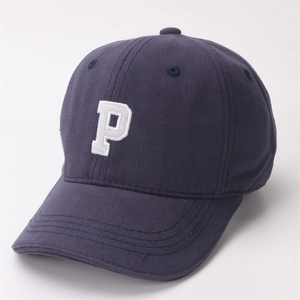 Detailed view of the white P letter embroidery on a navy blue children's baseball cap