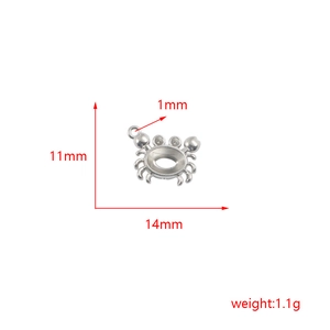 Detail view of crab pendant with dimensions 11mm by 14mm and 1.1g weight spec