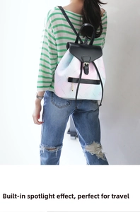 Detail view of macaron gradient backpack with black faux leather straps and gold buckles