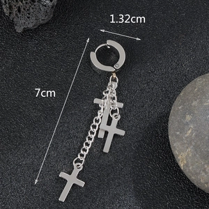 Macro shot of silver stainless steel cross earrings with dimensions 1.32cm by 7cm