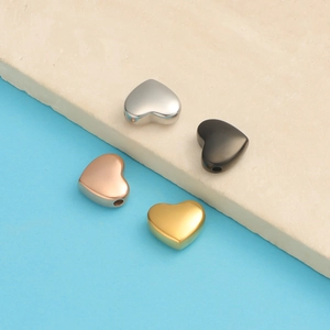 Polished stainless steel heart beads in silver, gold, rose gold and black finishes