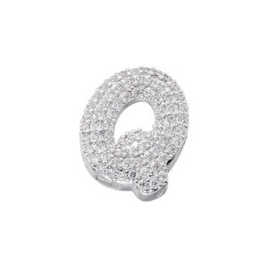Macro detail of silver capital letter Q pendant with shimmering cubic zirconia stones