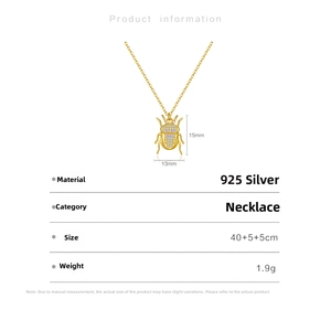 Detail of 925 sterling silver beetle pendant necklace with purple and white cubic zirconia