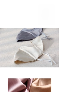 Detail of adjustable 0.1cm elastic ear loops on a premium silk sun protection face mask