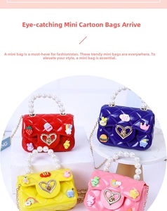 Close-up of mini jelly bags with pearl handles, heart locks and colorful cartoon charms