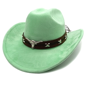 Detail of mint green suede cowboy hat featuring bull head metal buckle and stud leather band
