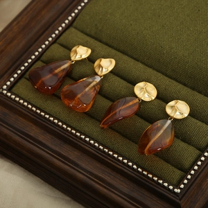 Vintage amber resin earrings with matte gold geometric pendants in a velvet box