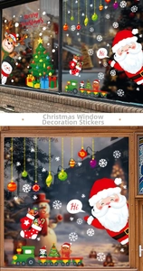 Detailed scene of Santa and reindeer static window decals on glass storefront and home windows