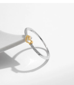 Detailed close-up of s925 silver ring featuring a gold hollow heart with sparkling zircon