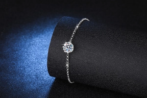 Detail of s925 silver snowflake bracelet featuring a brilliant round moissanite center stone