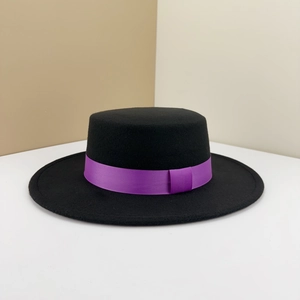 Detail of classic black wool felt bolero hat with a glossy purple decorative ribbon