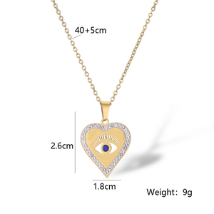Detail of gold heart pendant with evil eye motif and dimensions showing 40+5cm chain length