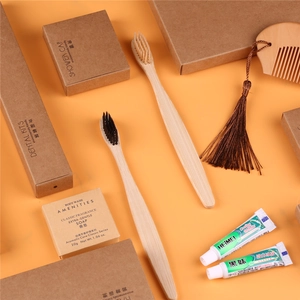 Eco-friendly hotel amenities set with bamboo toothbrush wood comb and soap in kraft paper packaging
