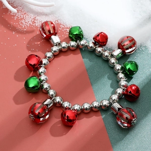Christmas charm bracelet with red and green bells on silver beads with snow-like background