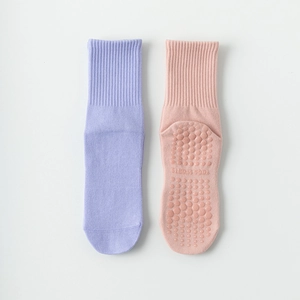 Non-slip cotton yoga socks for women with silicone grips and ribbed cuffs in pastel colors