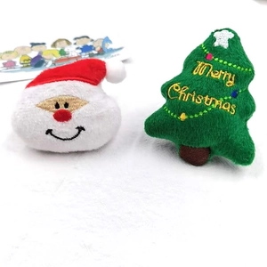Christmas plush dolls featuring Santa Claus and green tree with Merry Christmas embroidery