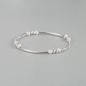 Elegant 925 sterling silver beaded bracelet featuring white baroque pearls and silver spheres
