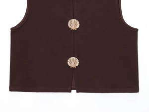 Detailed close-up of dark brown vest featuring golden shell-shaped decorative buttons