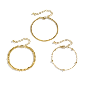 Three-piece set of minimalist gold snake bone and cuban link bracelets for women