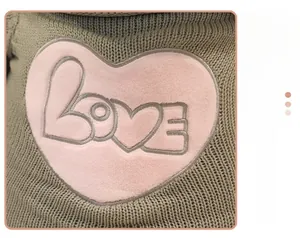 Detail of grey-green knitted panda sweater featuring a pink LOVE heart embroidery