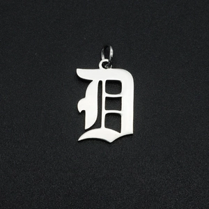 Detailed view of a polished stainless steel Gothic letter D pendant with a top ring