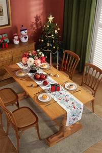 Detailed Christmas table runner featuring reindeer and snowflake prints on cotton linen