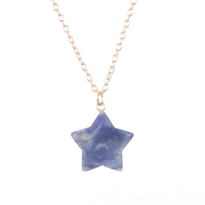 Detail of blue spotted natural stone star pendant on a fine golden necklace chain