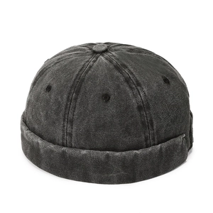 Washed black denim docker hat with vintage brimless design and metal eyelets